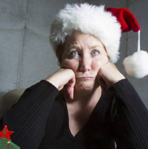 grumpy woman in Santa hat