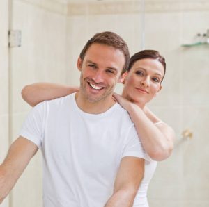 happy couple sharing a bathroom