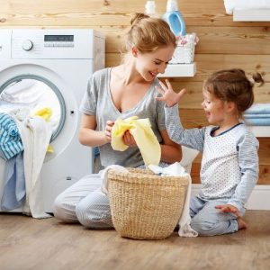 mother and daughter doing laundry
