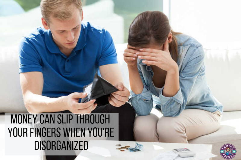 distressed couple looking through a wallet would benefit from getting their finances organized.
