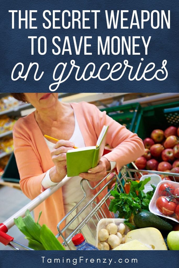 woman uses a grocery price book to save money at the supermarket