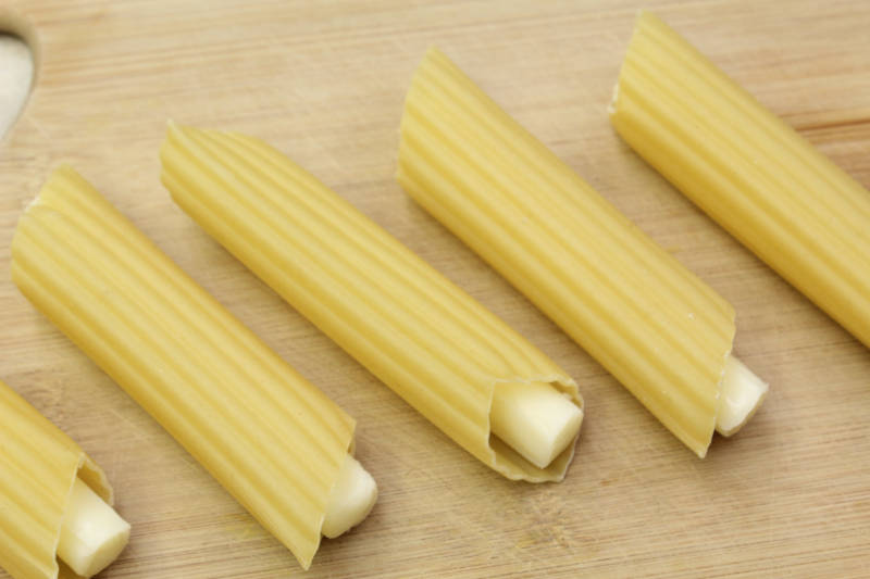cheese stick inside manicotti shell prior to coooking