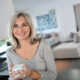 smiling woman knows the benefits of decluttering