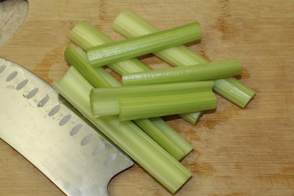fresh celery stalks prepped and ready to chop