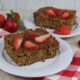 Oatmeal Breakfast Cake on white plate with strawberries